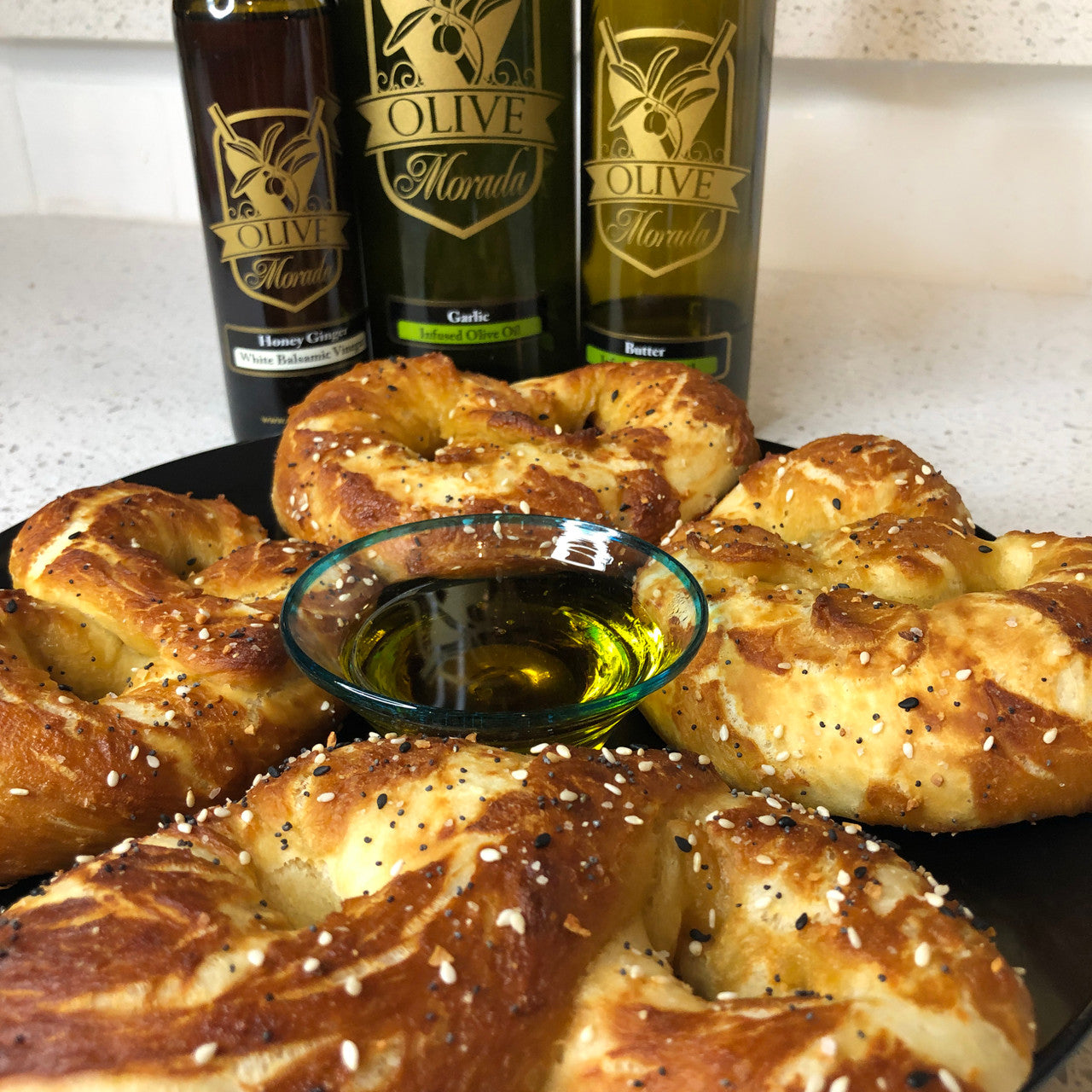 Honey Ginger Balsamic pairs perfectly with Garlic Olive Oil as a dip for these amazing homemade soft pretzels 